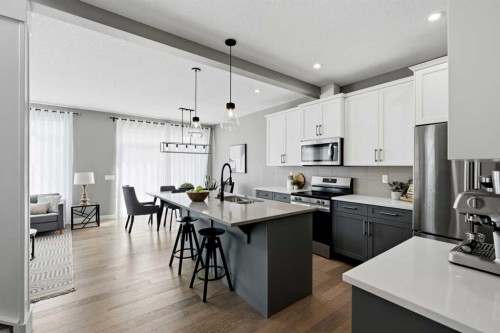 201 Marina Key, Chestermere, AB - Indoor Photo Showing Kitchen With Stainless Steel Kitchen With Double Sink With Upgraded Kitchen