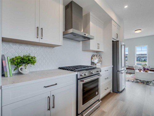 6106-200 Southridge Drive, Okotoks, AB - Indoor Photo Showing Kitchen With Stainless Steel Kitchen With Upgraded Kitchen