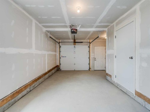 6106-200 Southridge Drive, Okotoks, AB - Indoor Photo Showing Garage