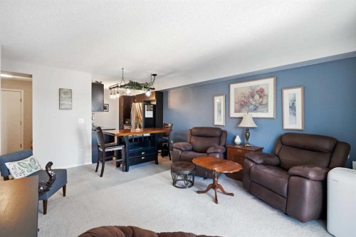 2409-60 Panatella Street, Calgary, AB - Indoor Photo Showing Living Room