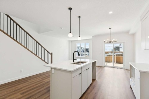 89 Heritage Park, Cochrane, AB - Indoor Photo Showing Kitchen With Double Sink