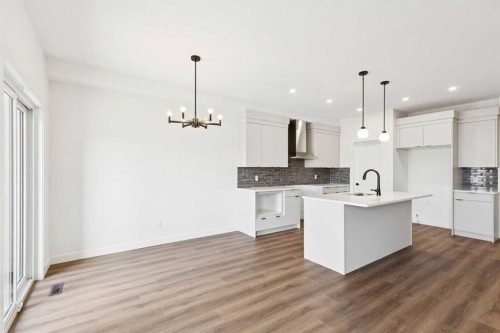 89 Heritage Park, Cochrane, AB - Indoor Photo Showing Kitchen With Upgraded Kitchen