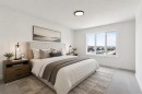 89 Heritage Park, Cochrane, AB  - Indoor Photo Showing Bedroom 