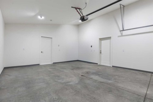 8 Diamond Valley Close, Carbon, AB - Indoor Photo Showing Garage