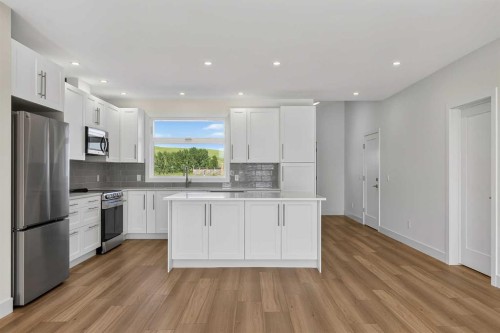 8 Diamond Valley Close, Carbon, AB - Indoor Photo Showing Kitchen With Stainless Steel Kitchen With Upgraded Kitchen