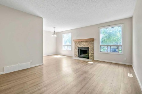 122 Bergen Road Nw, Calgary, AB - Indoor Photo Showing Living Room With Fireplace