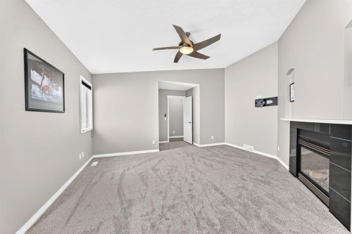 142 Strathmore Lakes Place, Strathmore, AB - Indoor Photo Showing Other Room With Fireplace