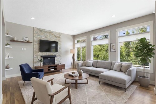 16 Auburn Sound Crescent Se, Calgary, AB - Indoor Photo Showing Living Room With Fireplace