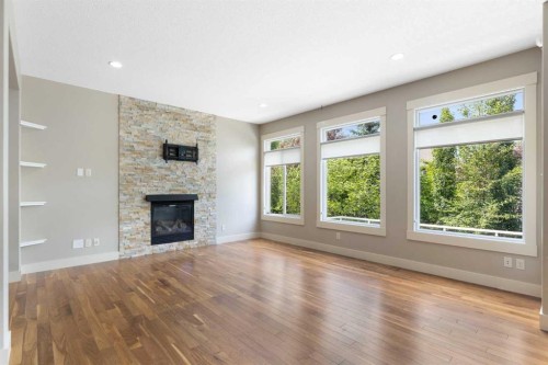 16 Auburn Sound Crescent Se, Calgary, AB - Indoor Photo Showing Living Room With Fireplace