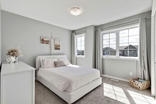 1714 Montgomery Gate Se, High River, AB - Indoor Photo Showing Bedroom