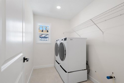 53 Versant Point Sw, Calgary, AB - Indoor Photo Showing Laundry Room