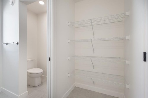 53 Versant Point Sw, Calgary, AB - Indoor Photo Showing Other Room