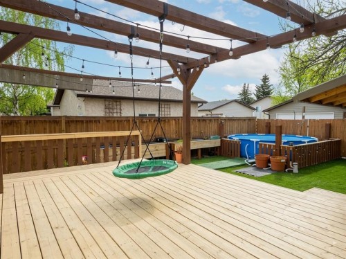 80 Taylor Way Se, Airdrie, AB - Outdoor With Above Ground Pool With Deck Patio Veranda With Exterior