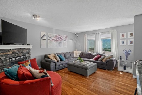 13 Coventry Way Ne, Calgary, AB - Indoor Photo Showing Living Room With Fireplace