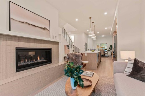 2-8916 33 Avenue Nw, Calgary, AB - Indoor Photo Showing Living Room With Fireplace