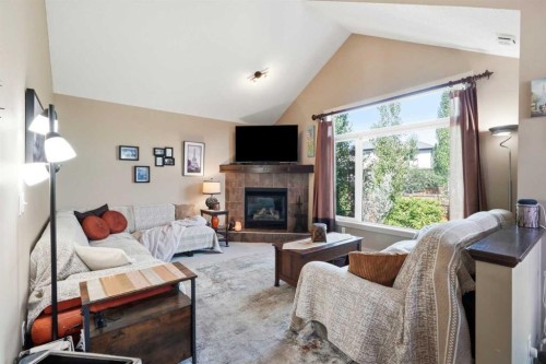 260 Willow Ridge Manor Sw, Diamond Valley, AB - Indoor Photo Showing Living Room With Fireplace
