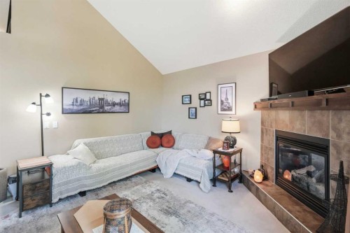 260 Willow Ridge Manor Sw, Diamond Valley, AB - Indoor Photo Showing Living Room With Fireplace