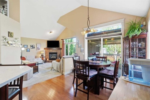 260 Willow Ridge Manor Sw, Diamond Valley, AB - Indoor Photo Showing Dining Room With Fireplace