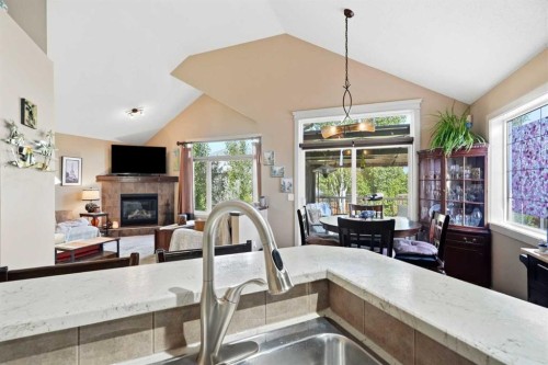 260 Willow Ridge Manor Sw, Diamond Valley, AB - Indoor Photo Showing Other Room With Fireplace