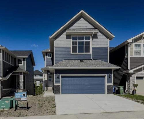 47 Sundown Crescent, Cochrane, AB - Outdoor With Facade