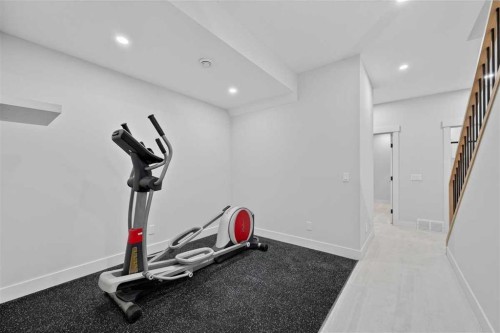 924 33A Street Nw, Calgary, AB - Indoor Photo Showing Gym Room