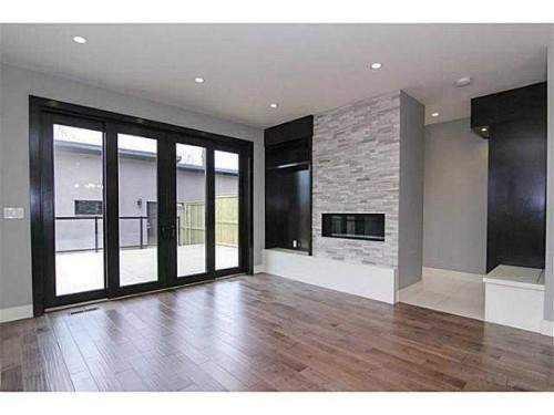 532 22 Avenue Ne, Calgary, AB - Indoor Photo Showing Other Room With Fireplace