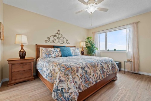 241 Sunset Heights, Cochrane, AB - Indoor Photo Showing Bedroom