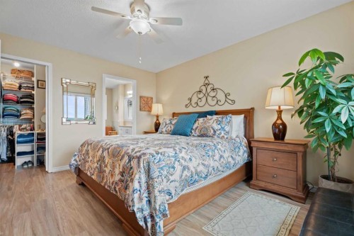241 Sunset Heights, Cochrane, AB - Indoor Photo Showing Bedroom