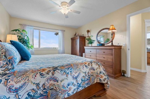 241 Sunset Heights, Cochrane, AB - Indoor Photo Showing Bedroom