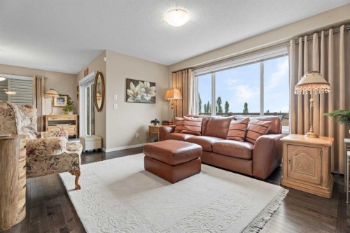 241 Sunset Heights, Cochrane, AB - Indoor Photo Showing Living Room