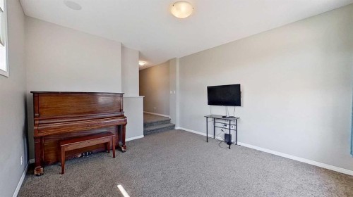 39 Sunrise View, Cochrane, AB - Indoor Photo Showing Other Room