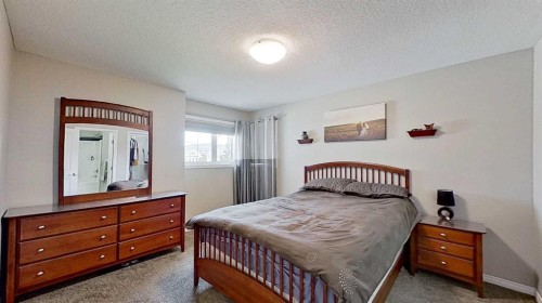 39 Sunrise View, Cochrane, AB - Indoor Photo Showing Bedroom