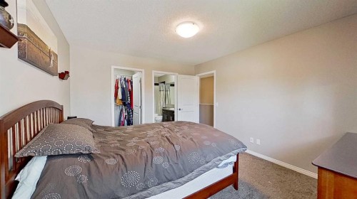 39 Sunrise View, Cochrane, AB - Indoor Photo Showing Bedroom