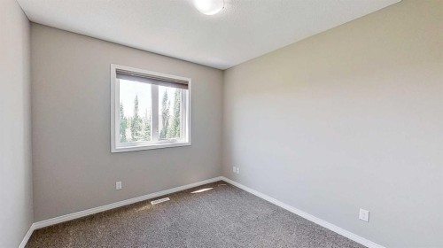 39 Sunrise View, Cochrane, AB - Indoor Photo Showing Other Room