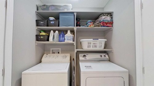 39 Sunrise View, Cochrane, AB - Indoor Photo Showing Laundry Room