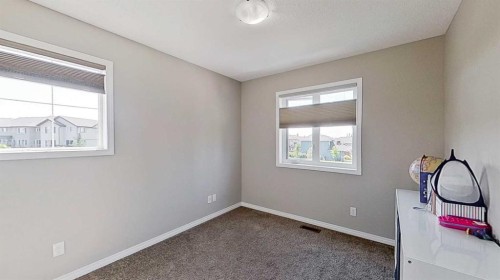 39 Sunrise View, Cochrane, AB - Indoor Photo Showing Other Room