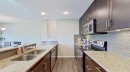 39 Sunrise View, Cochrane, AB  - Indoor Photo Showing Kitchen With Double Sink With Upgraded Kitchen 
