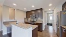 39 Sunrise View, Cochrane, AB  - Indoor Photo Showing Kitchen With Upgraded Kitchen 