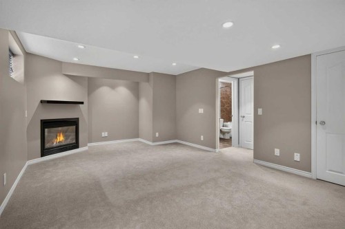 59 Silver Springs Way Nw, Airdrie, AB - Indoor With Fireplace
