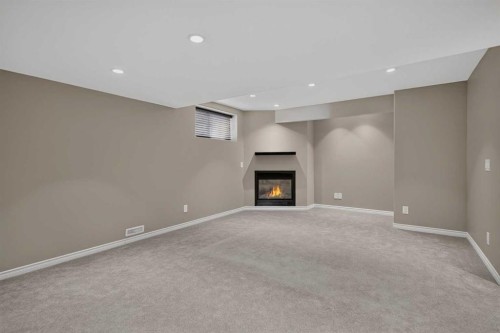 59 Silver Springs Way Nw, Airdrie, AB - Indoor With Fireplace