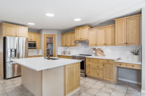 132 Coopers Heights Sw, Airdrie, AB - Indoor Photo Showing Kitchen With Stainless Steel Kitchen With Double Sink