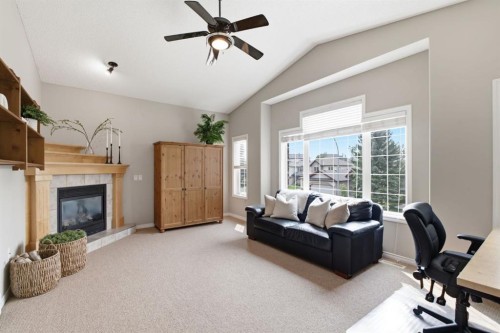 132 Coopers Heights Sw, Airdrie, AB - Indoor With Fireplace