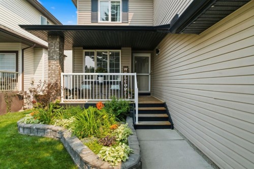 132 Coopers Heights Sw, Airdrie, AB - Outdoor With Deck Patio Veranda With Exterior