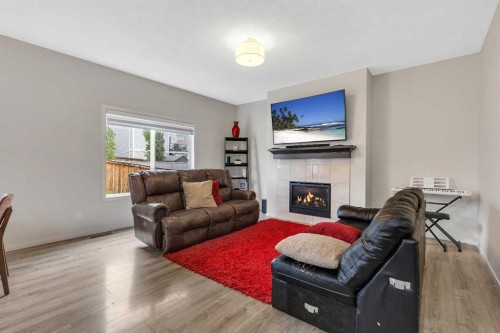 262 Hillcrest Heights Sw, Airdrie, AB - Indoor Photo Showing Living Room With Fireplace