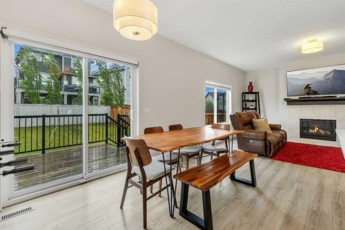 262 Hillcrest Heights Sw, Airdrie, AB - Indoor With Fireplace