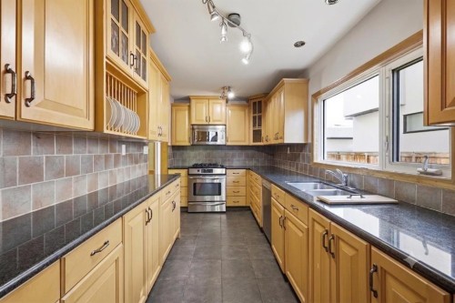 806 Radford Road Ne, Calgary, AB - Indoor Photo Showing Kitchen With Double Sink