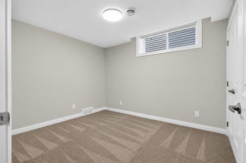 62 Evansfield Green Nw, Calgary, AB - Indoor Photo Showing Other Room