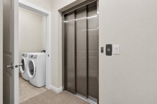 62 Evansfield Green Nw, Calgary, AB - Indoor Photo Showing Laundry Room