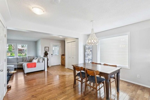 147 Sunset Cove, Cochrane, AB - Indoor Photo Showing Dining Room