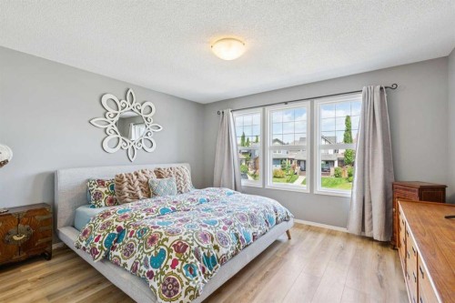 147 Sunset Cove, Cochrane, AB - Indoor Photo Showing Bedroom